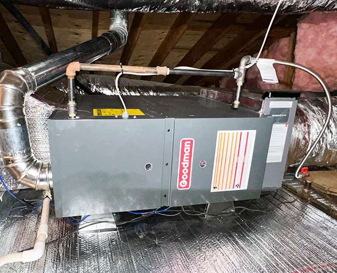 A Goodman furnace unit installed in an attic, showcasing professional furnace services in Fallbrook and throughout North San Diego County.