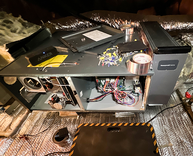 Open and partially disassembled heating unit revealing internal wiring and components, demonstrating the heater replacement process in Fallbrook and all of North San Diego County.